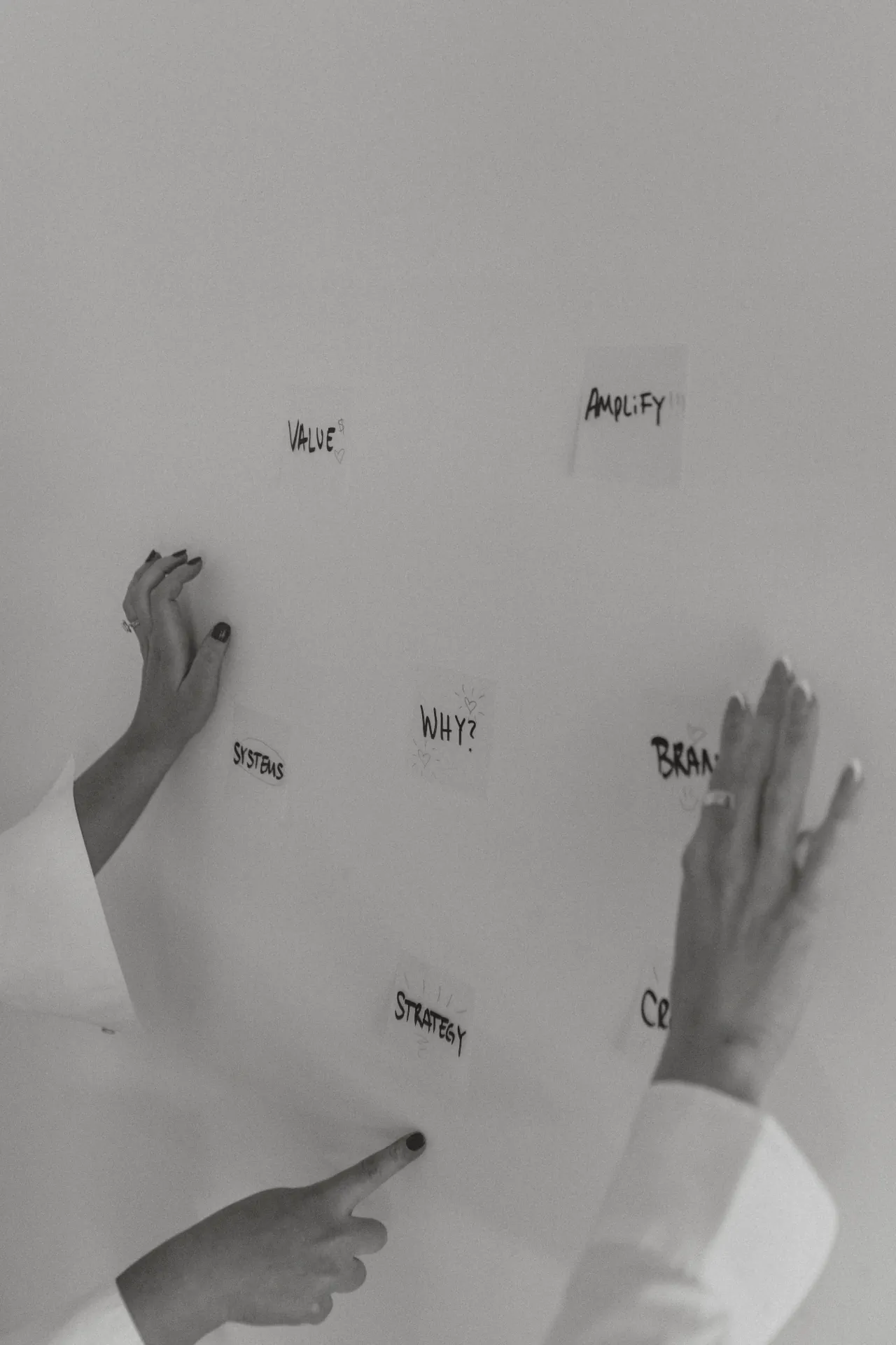 Hands against a textured wall